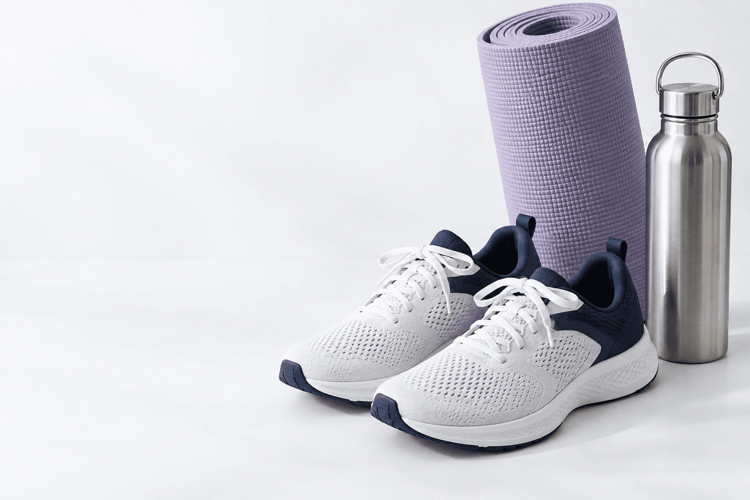 Illustrative still life of unbranded running shoes, an exercise mat and a water bottle, showing sport and leisure reward possibilities.